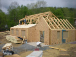 The timber frame structure is taking shape.