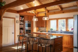 A timber frame kitchen with an island.