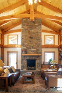 A timber frame great room with a large fireplace