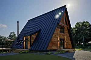Side view of the AspenValley A-frame cabin with dark metal roof, wood siding, entry porch, and chimney, highlighting the classic triangular form in a forest setting.