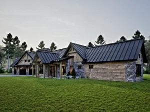 Front entrance of a mountain-style timber frame home with stone pillars, exposed timber details, covered porch, and black standing seam metal roofing.