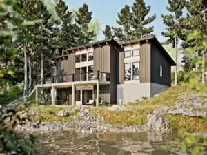 Lakeside view of the RiverRock V2 modern timber frame home featuring a walkout lower level, elevated deck, and contemporary mountain-inspired design.